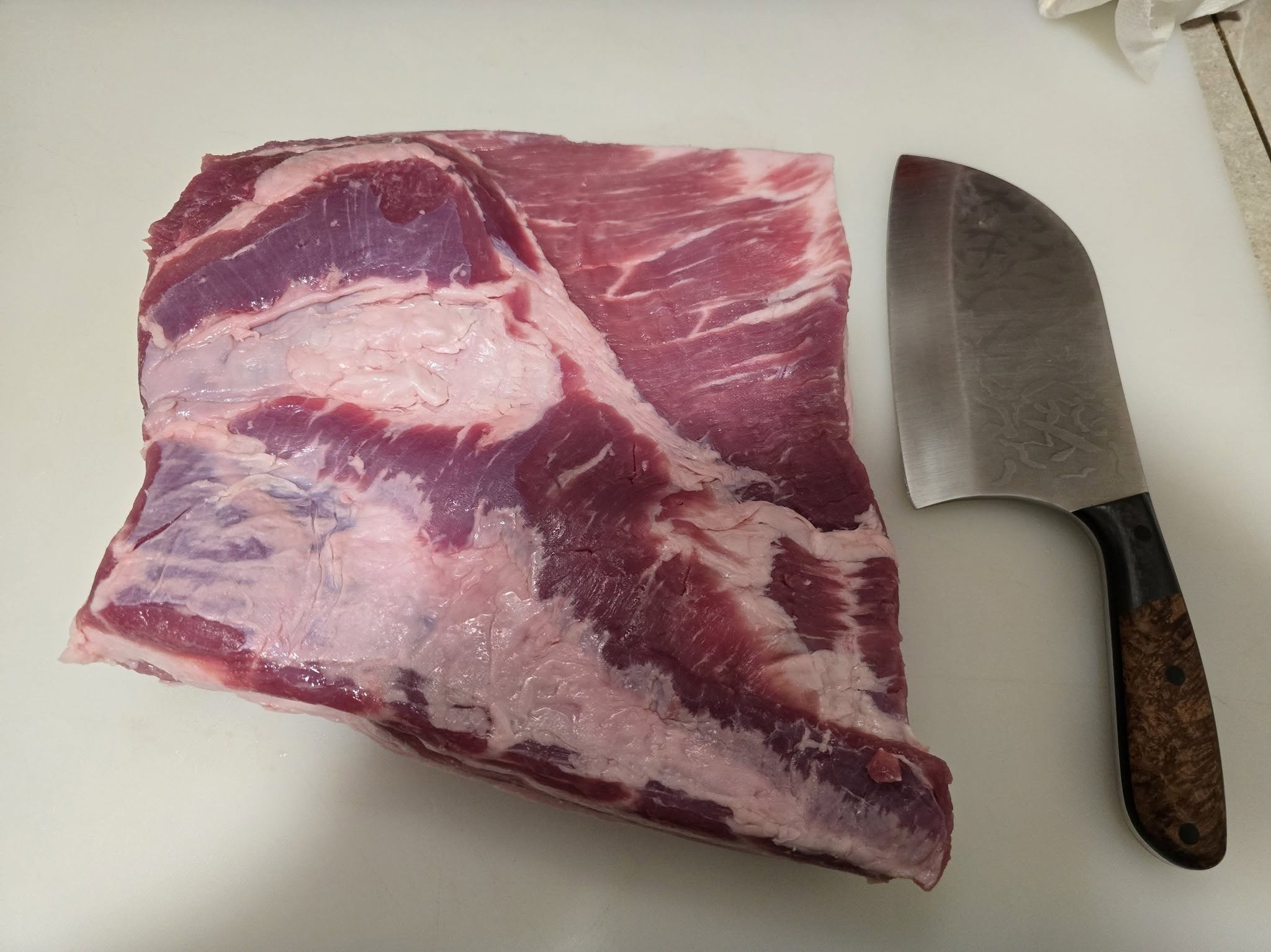 Raw pork belly prepared for bacon